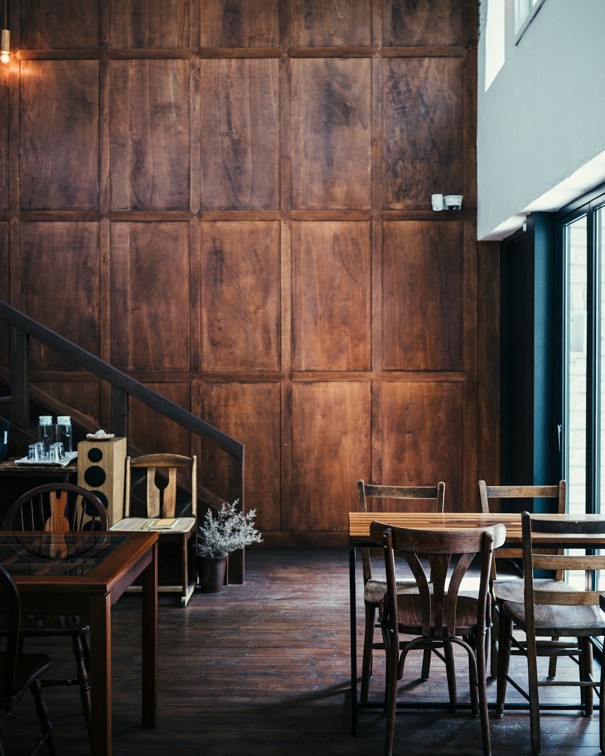 A dark timber panelled wall inside the room